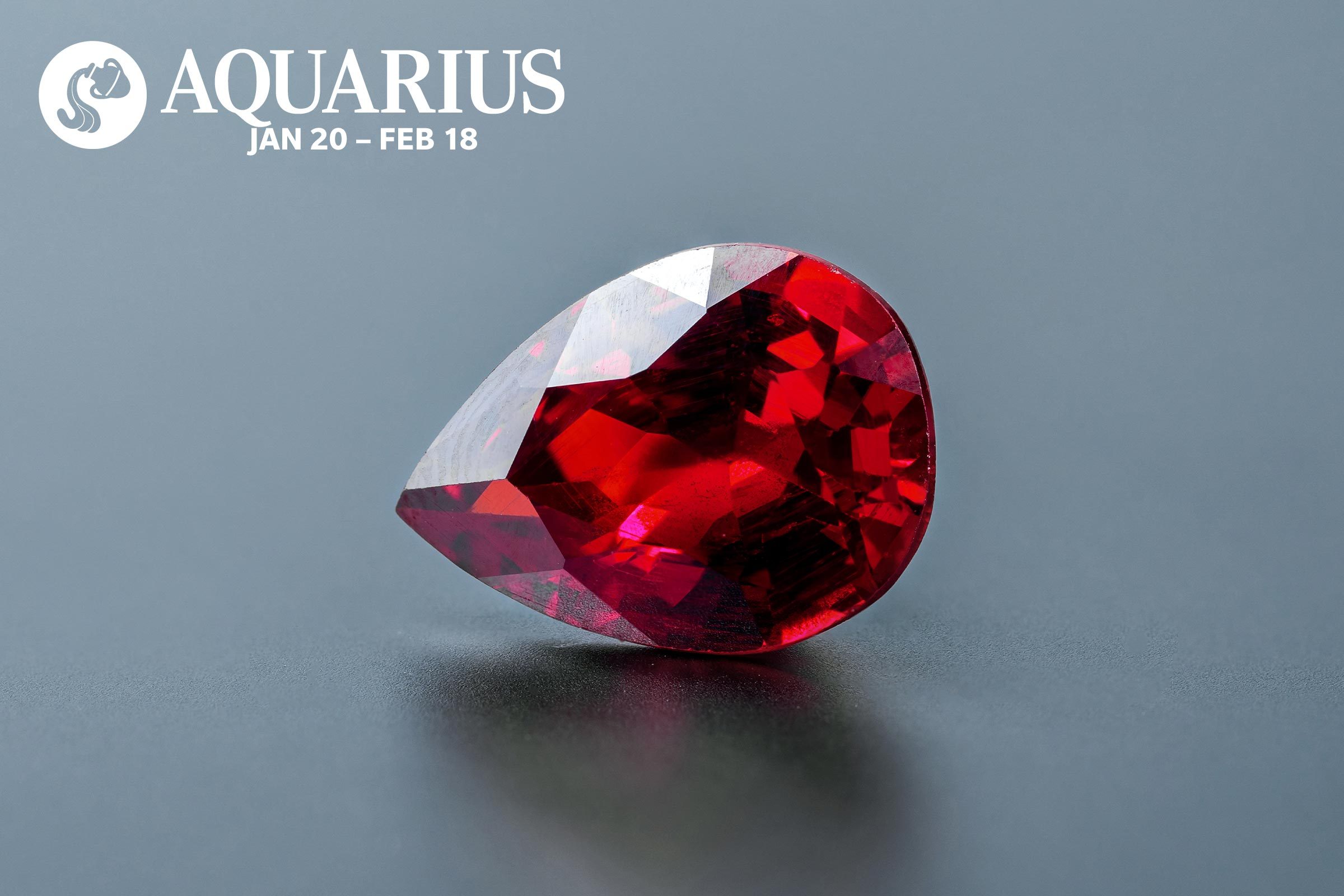 Garnet with the Aquarius symbol and dates in the upper left corner