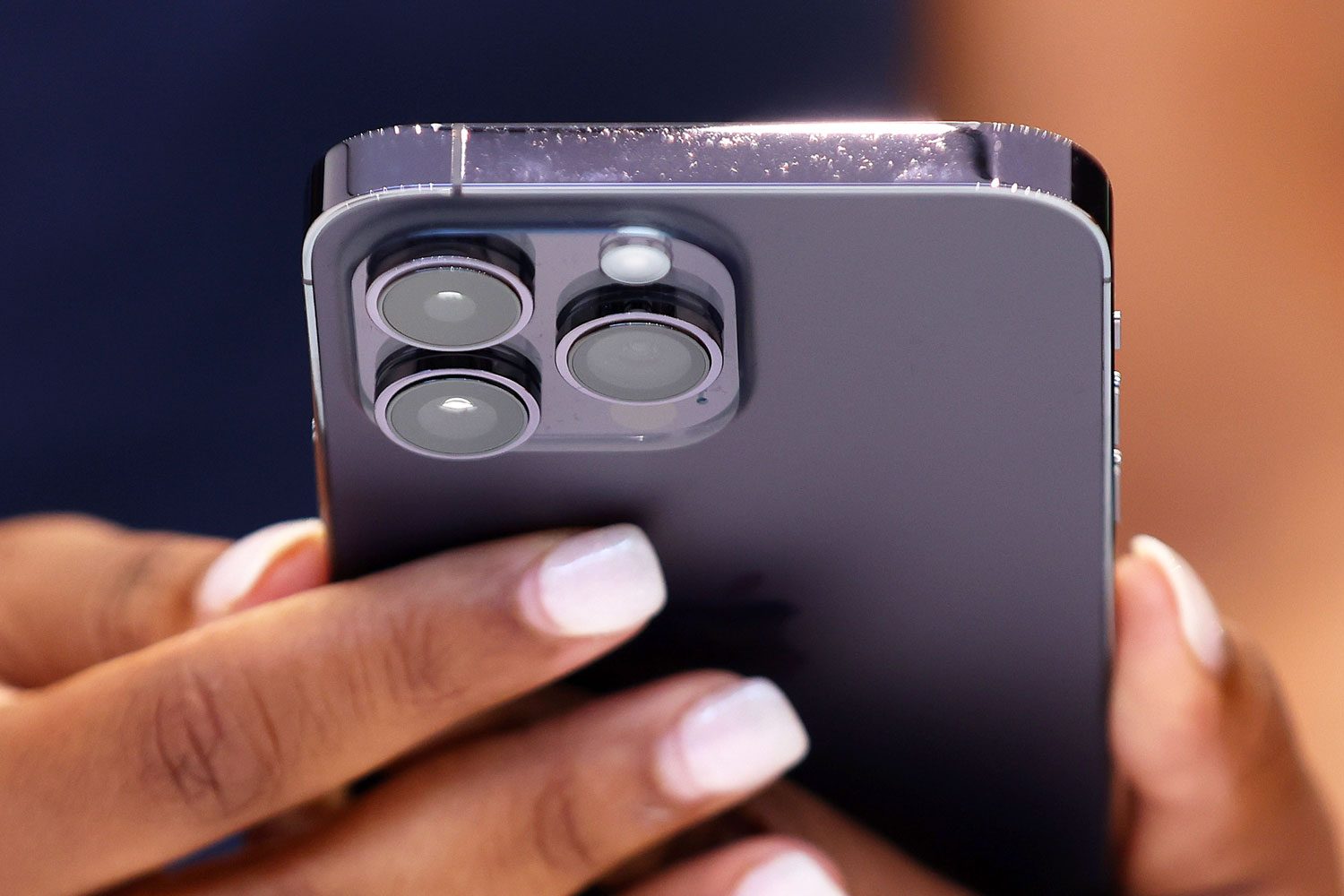 An attendee holds a new Apple iPhone 14 Pro during an Apple special event on September 07, 2022 in Cupertino, California