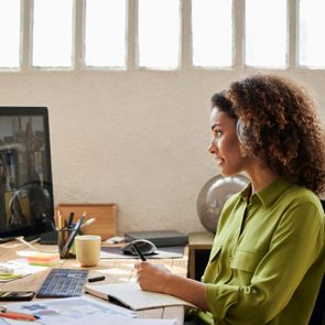 Businesswoman Planning Strategy With Colleagues on video call