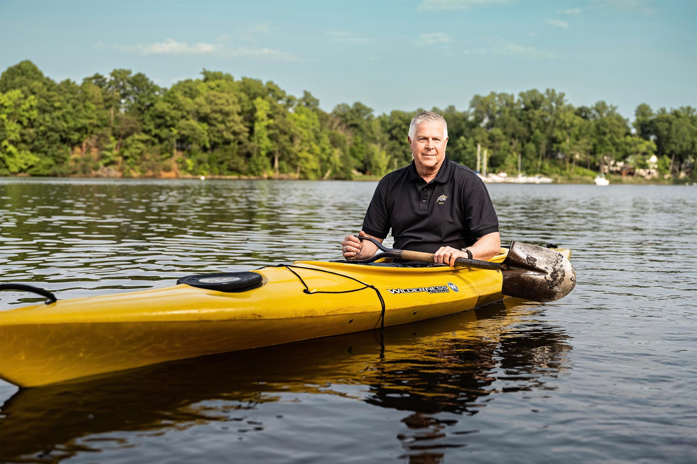 John Gelinne with the kayak and shovel he used to paddle to the pilot