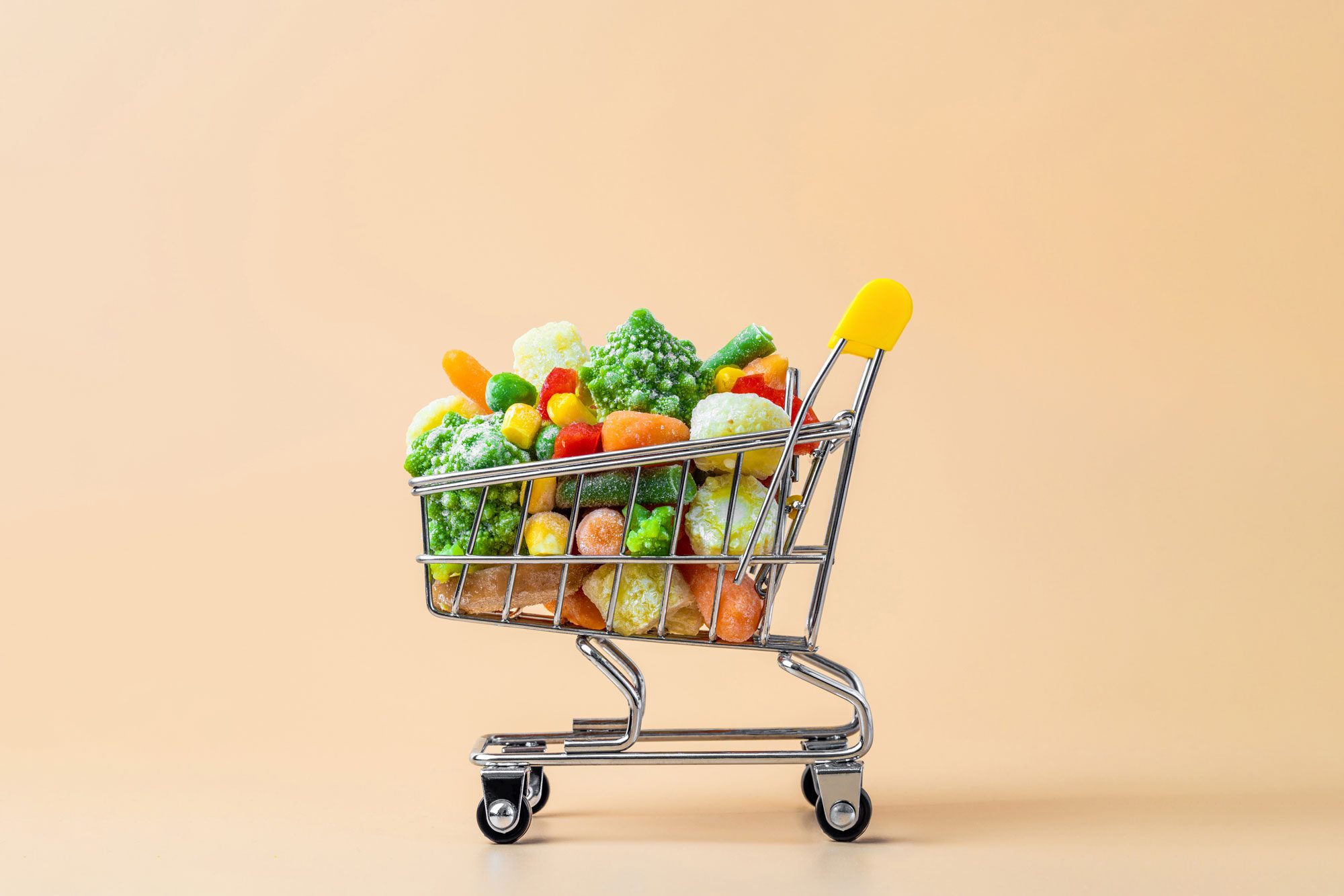 Frozen Vegetables Assorted On Beige, Top View