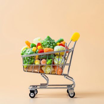 Frozen Vegetables Assorted On Beige, Top View