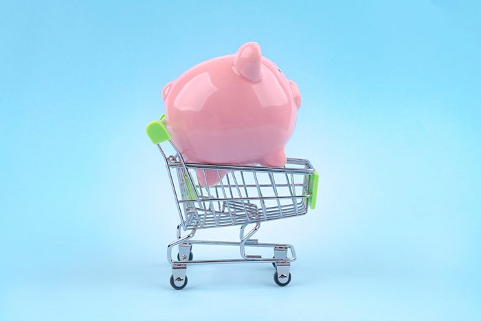 Saving money piggy bank blue background