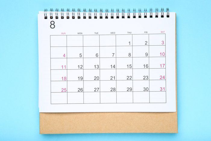 Paper calendar page on blue background