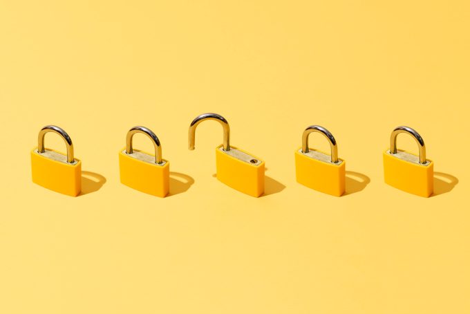 Five Yellow Padlocks On Yellow Background