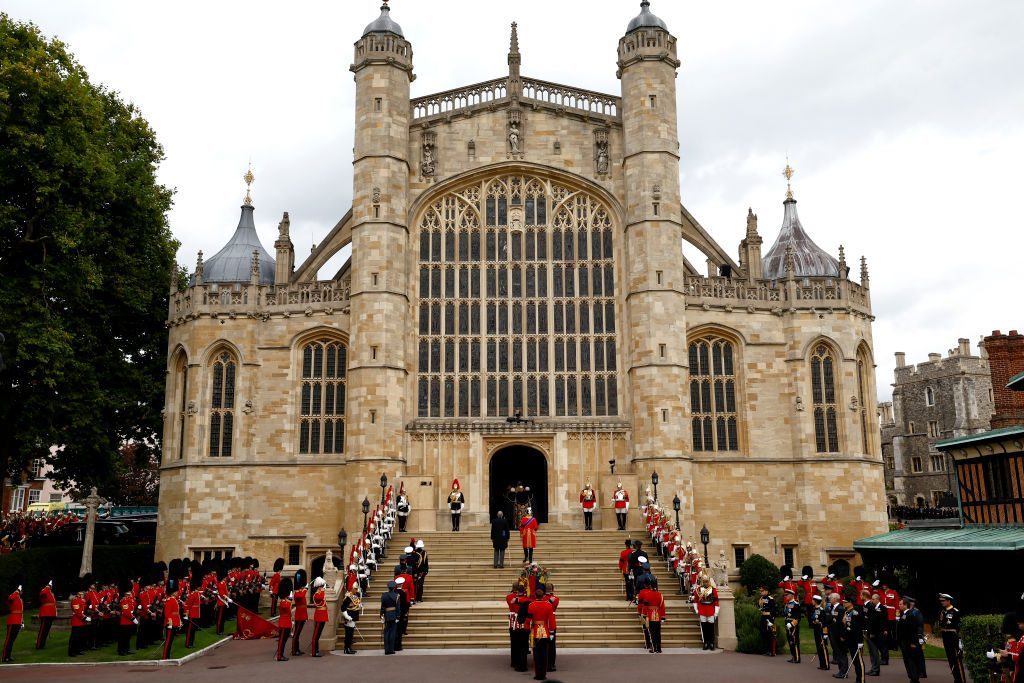 Pall bearers from the Queen's Company, 1st Battalion Grenadier Guards carry the coffin of Queen Elizabeth II with the Imperial State Crown resting on top into St. George's Chapel