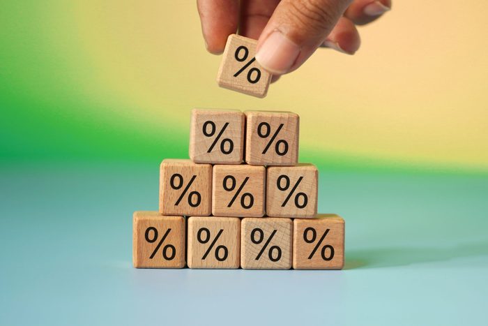 hand holding block , interest rate up concept photo