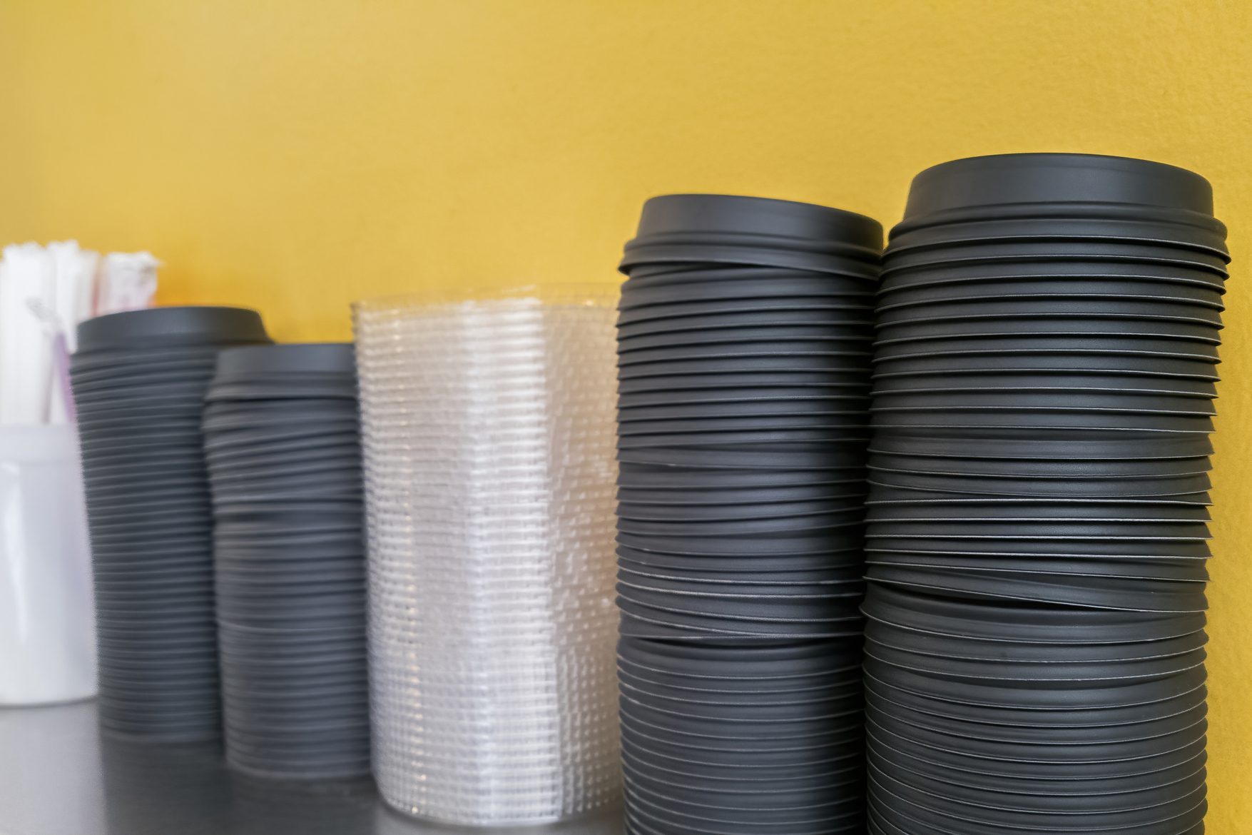 Coffee Cup Lids on a Shelf