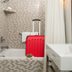 Here's Why You Should Put Luggage in Your Hotel Room's Bathtub