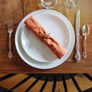 High Angle View Of Place Setting On Dining Room Table