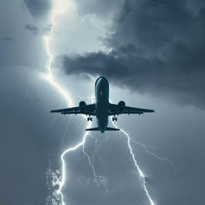 Airplane flying through lightning storm