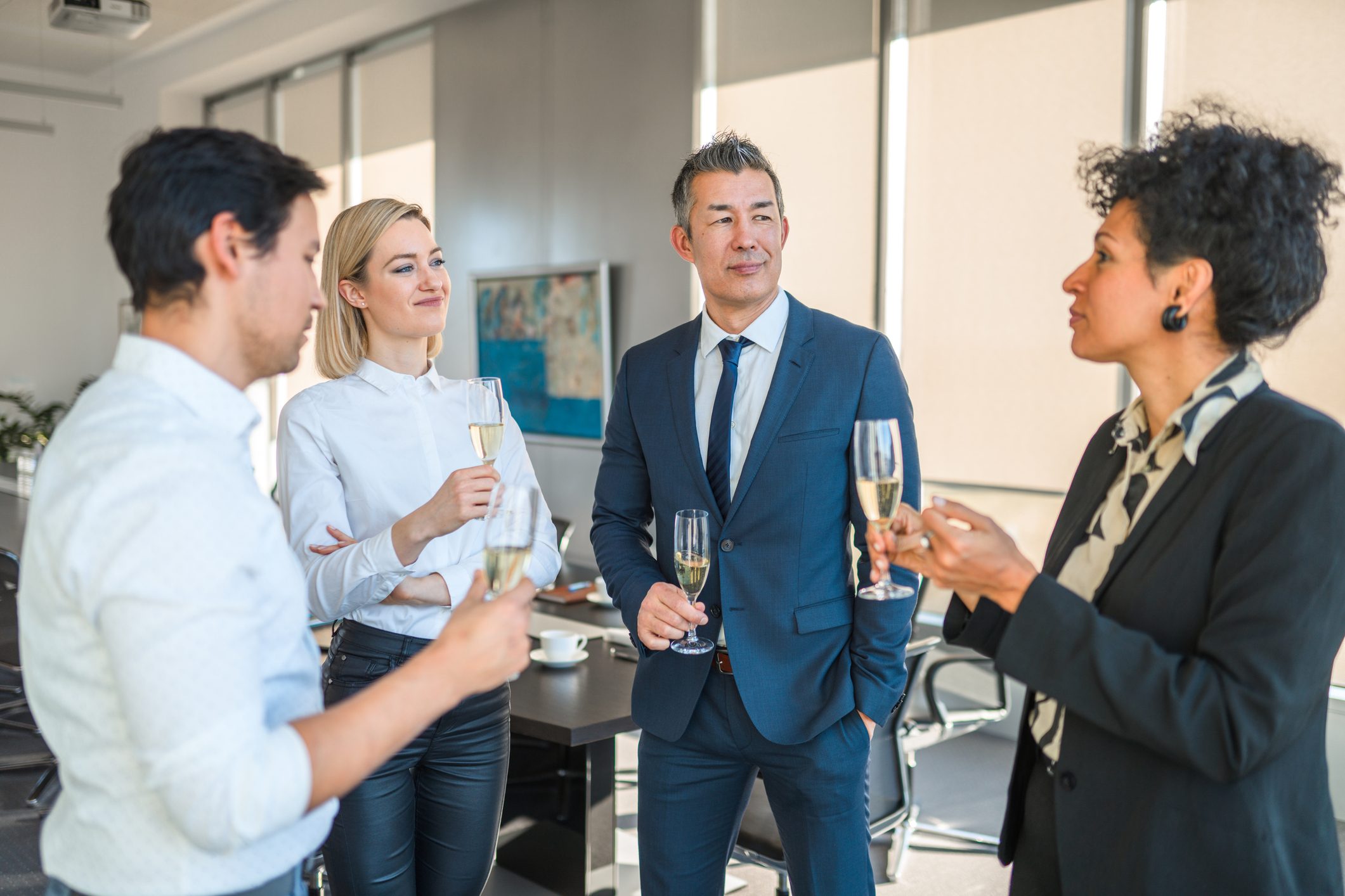 A Small Group Of Business People Celebrating After Conference