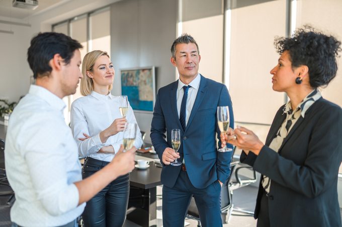 A Small Group Of Business People Celebrating After Conference