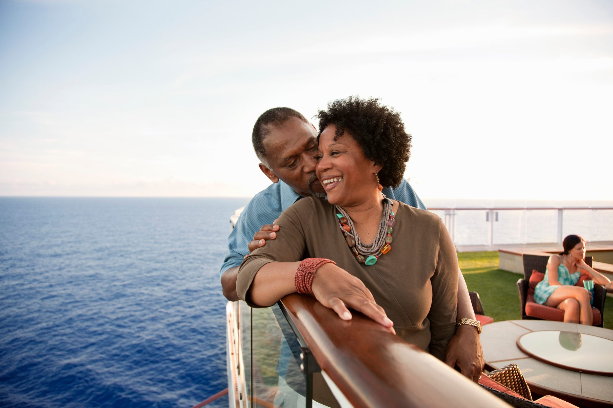 Couple on railing on deck