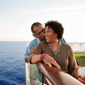 Couple on railing on deck