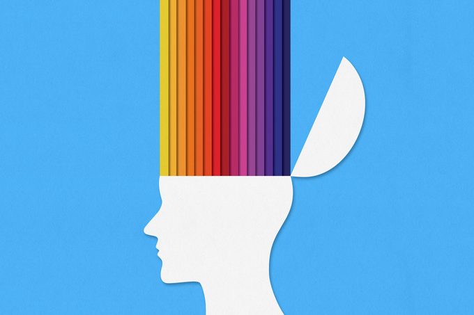 paper rainbow stripes coming out of paper head