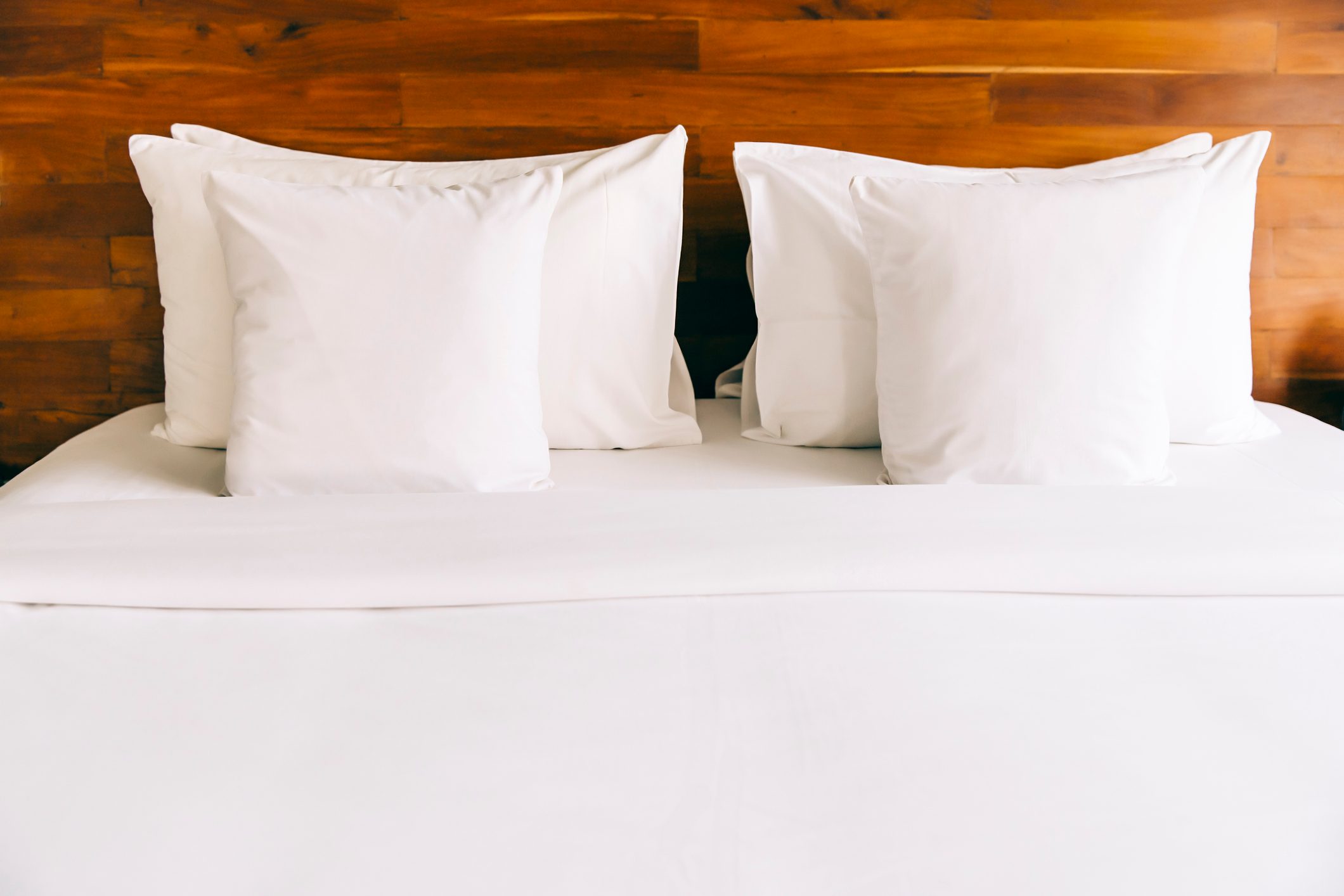 Empty bed in modern hotel room