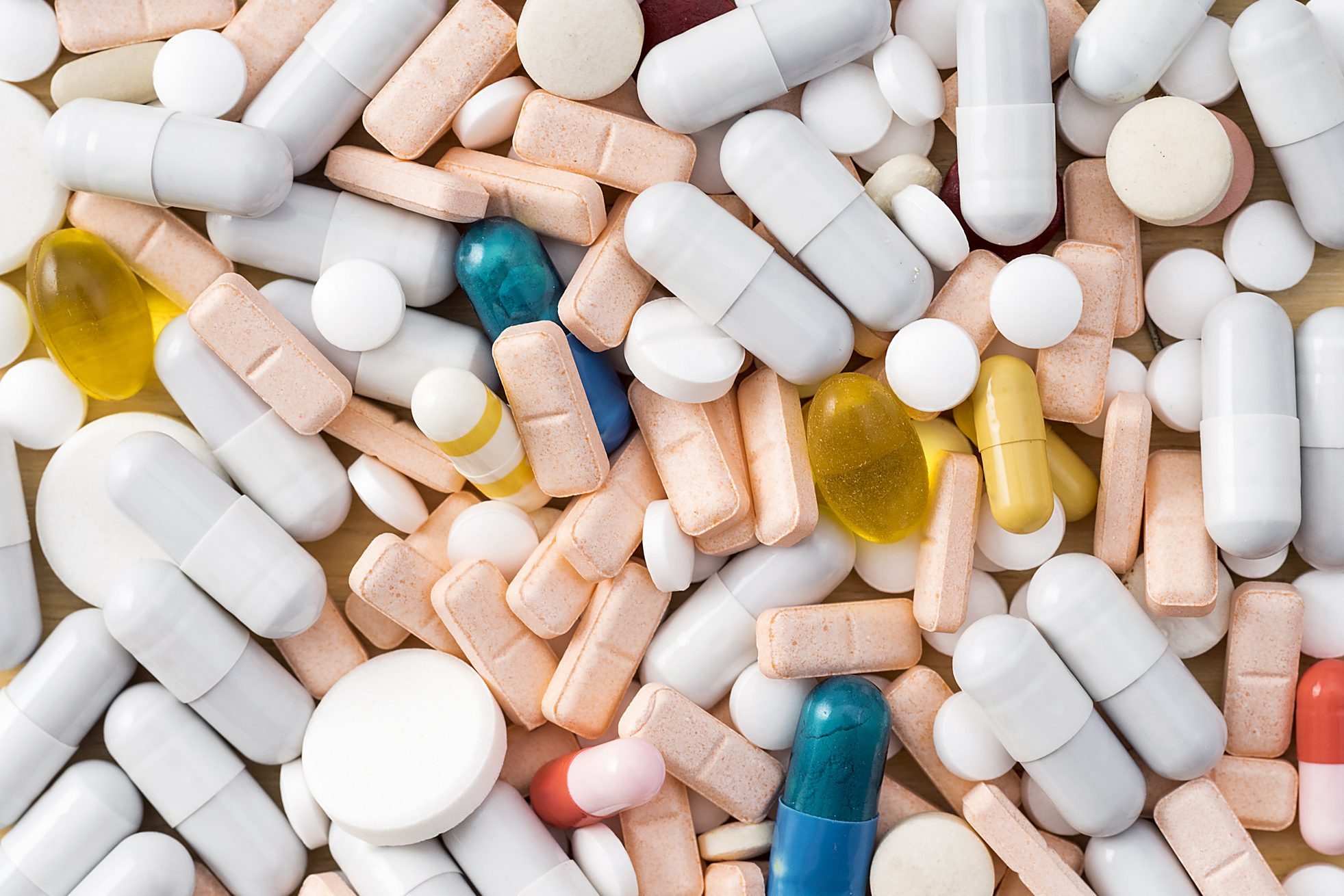 Full frame of various colors pills and capsules, close-up