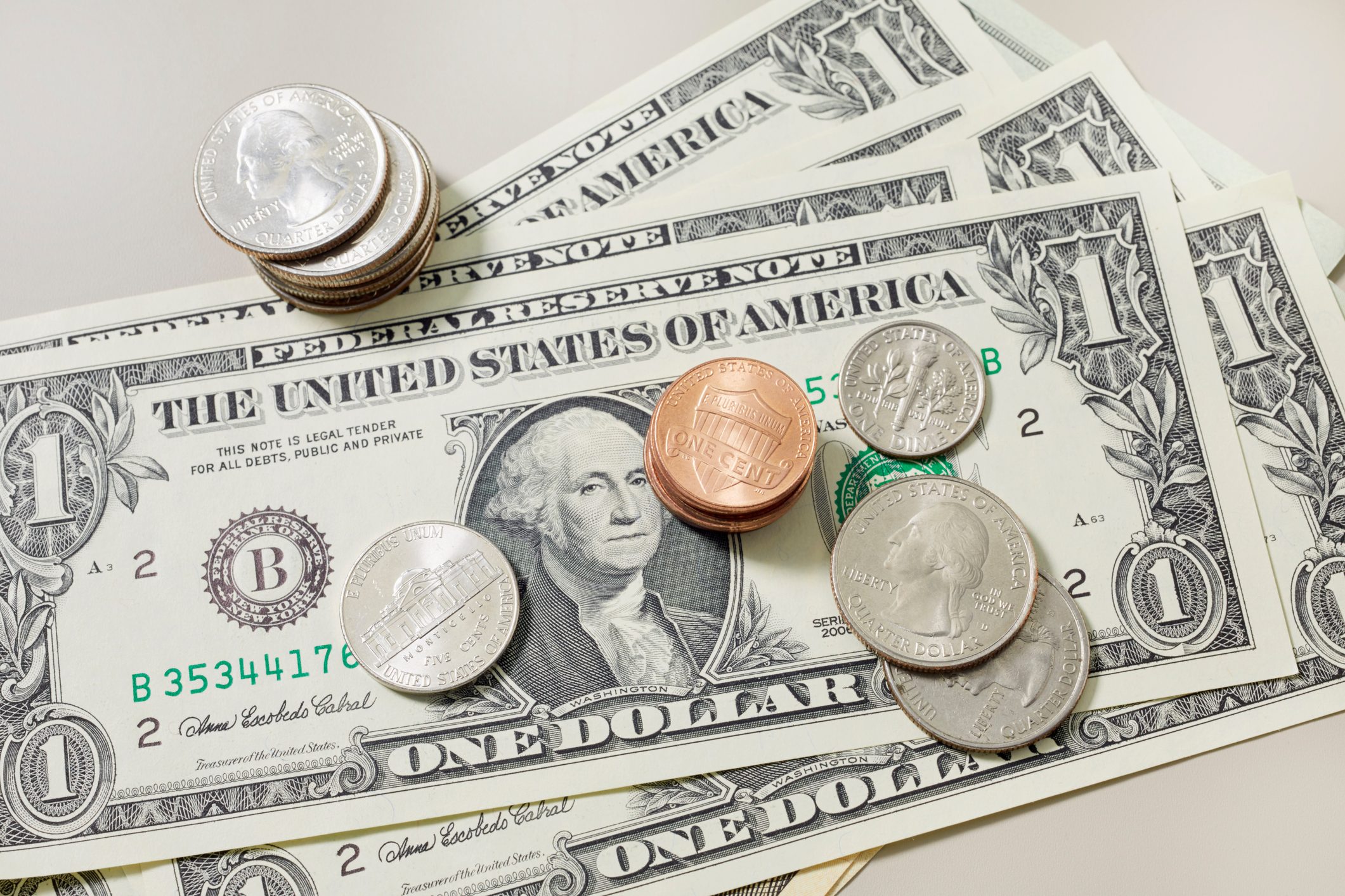 High angle view of American Dollar banknotes and coins