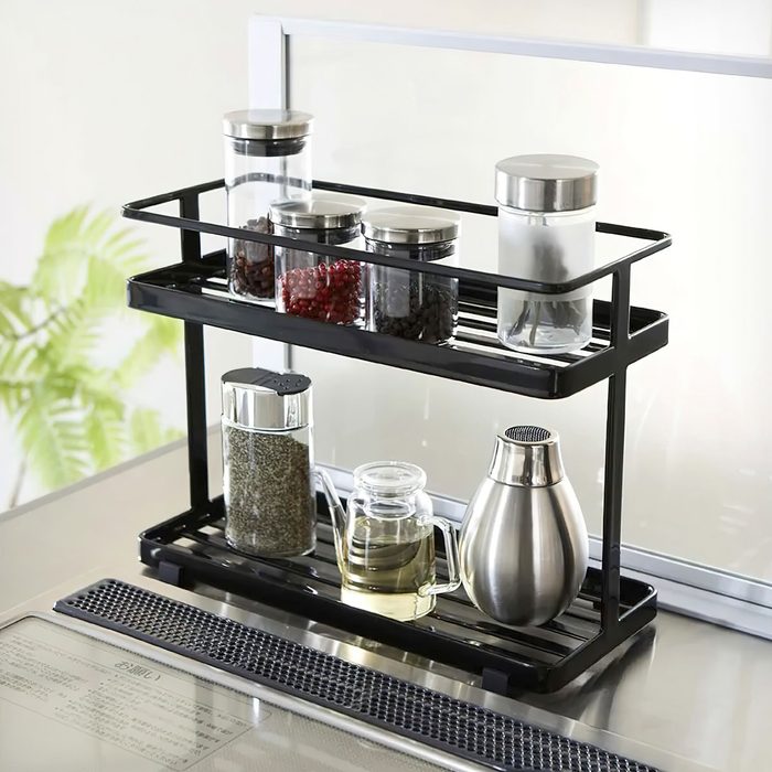 Glass Jars With Spices On The Rack In Kitchen