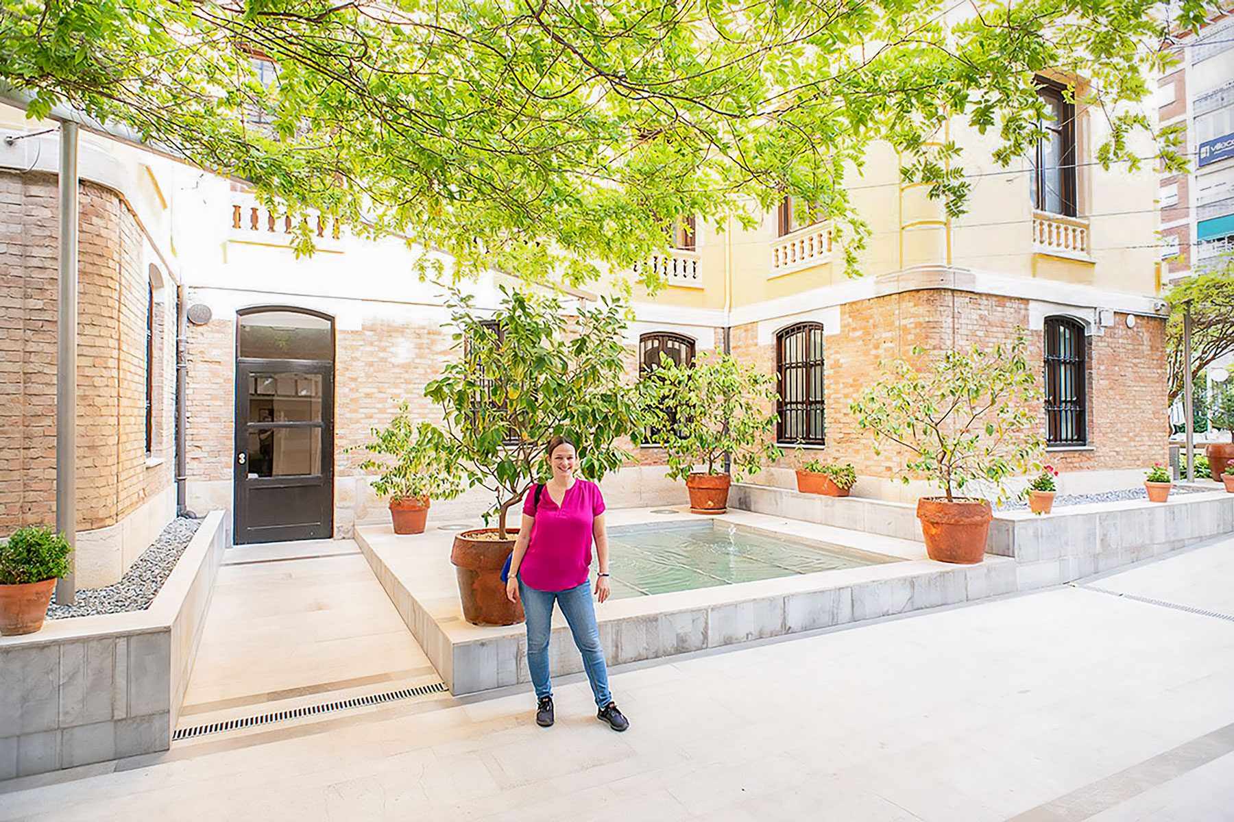 A Girl Standing Near Palacio De Los Patos Granada