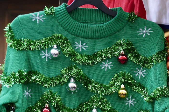 Beautiful or ugly: green Christmas sweater with decor balls