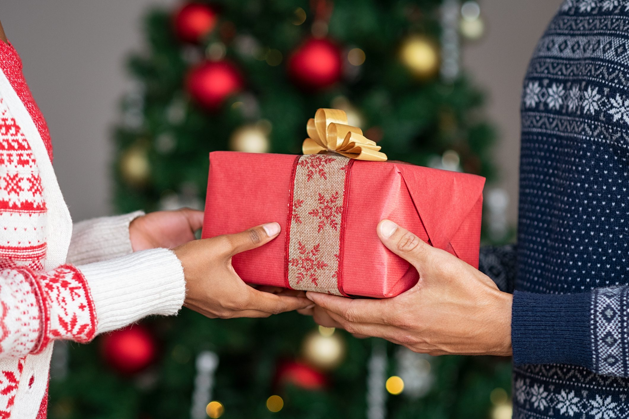 Hands giving christmas gifts