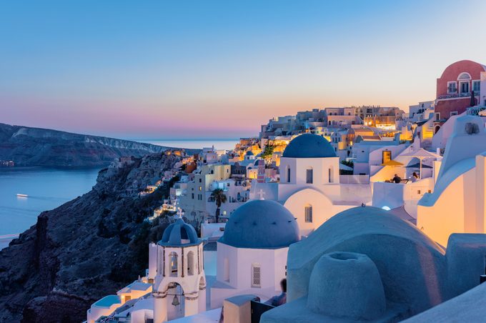 Oia, Santorini Island, Cyclades, Greece. Twilight, Houses and churches after sunset
