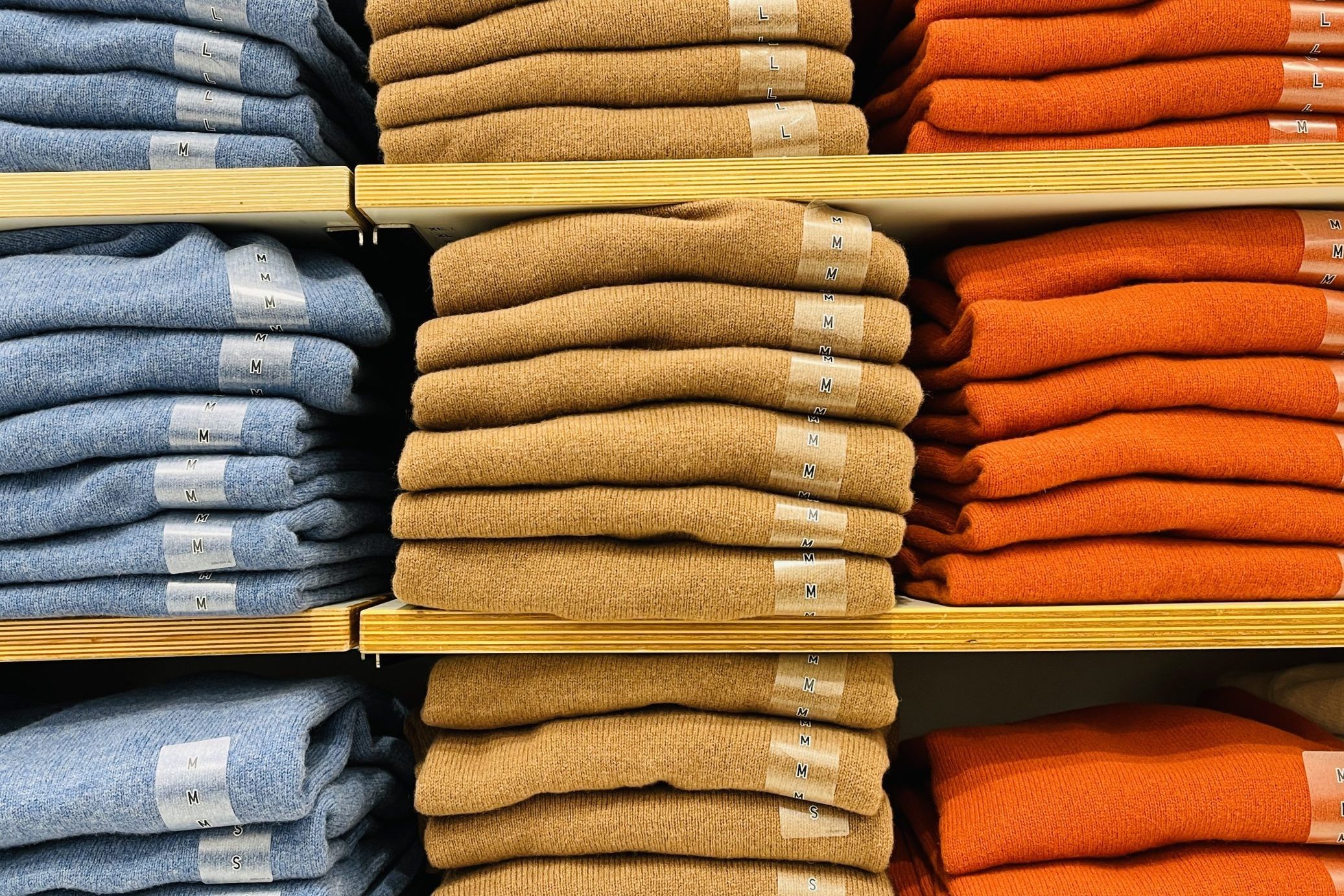 Close up of Colorful Shirts on shelf in a shop