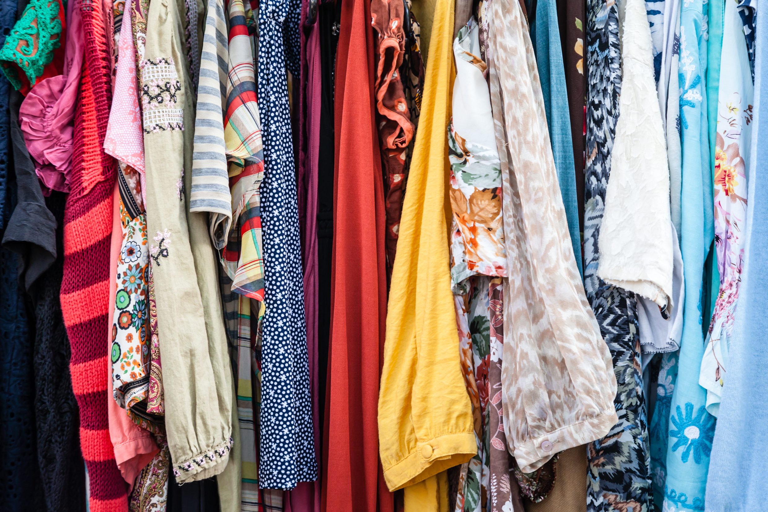 Colorful Rack of Old Used Vintage Clothes for Sale