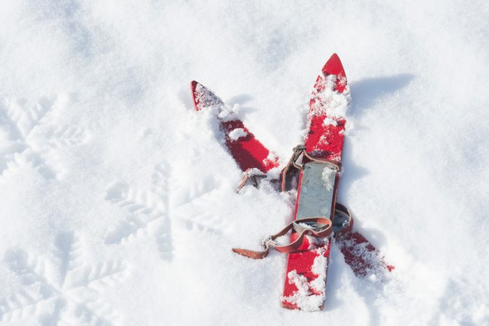 pair of red children's ski on snow