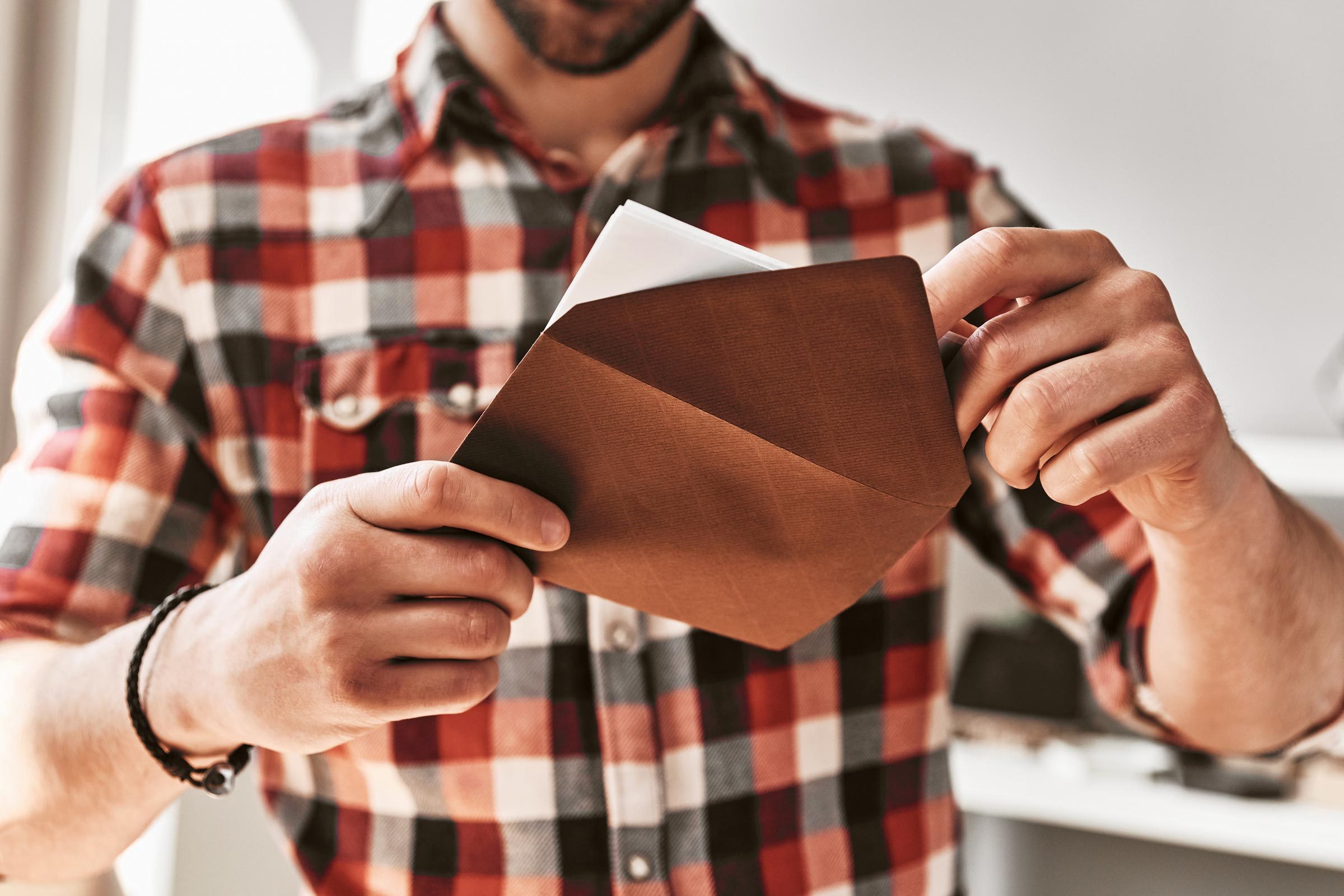 man reading thank you card