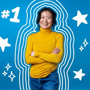 confident woman standing with arms crossed, star doodles