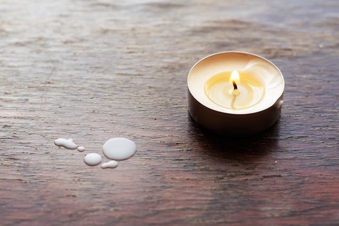 tea light candle drip on wood
