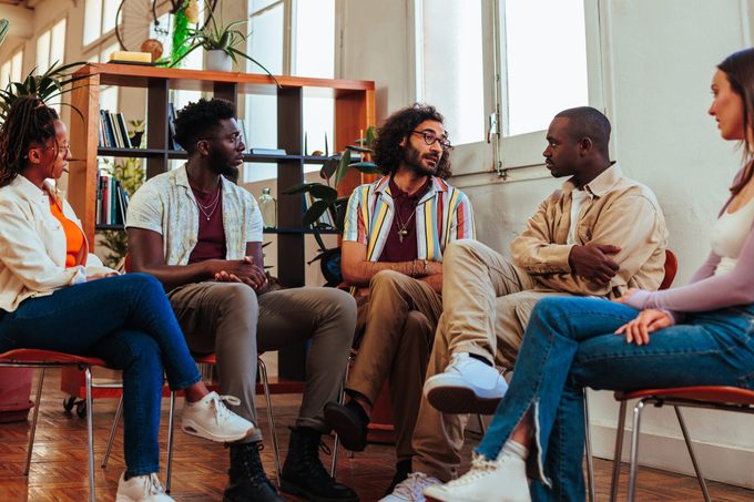 friends playing a name game while sitting in a circle