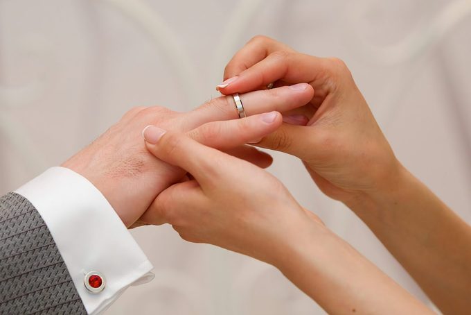 The bride and groom put the ring on the wedding ceremony