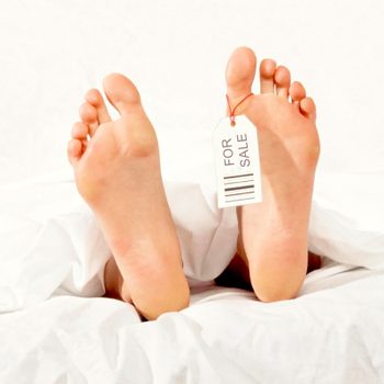 foot with a price tag that says "for sale" on it