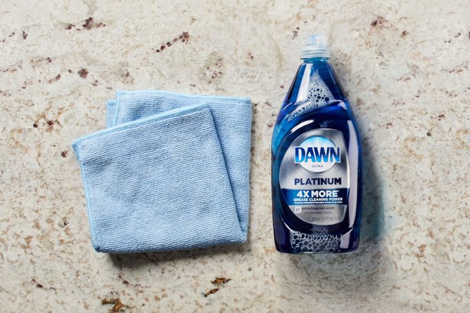 microfiber cloth and dish soap on a countertop
