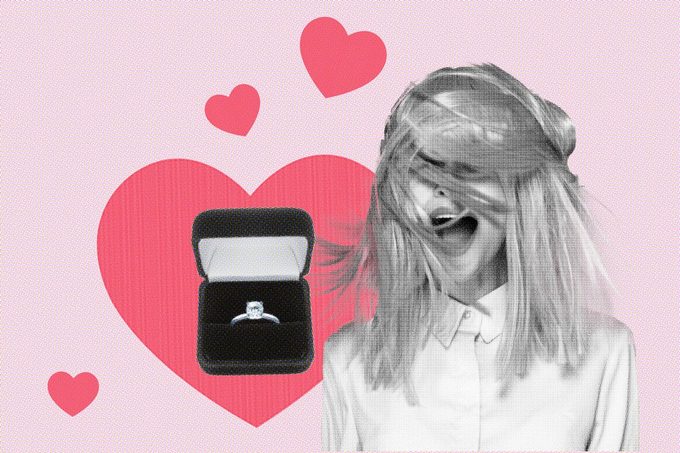woman with wind blown hair and an engagement ring with hearts in the background