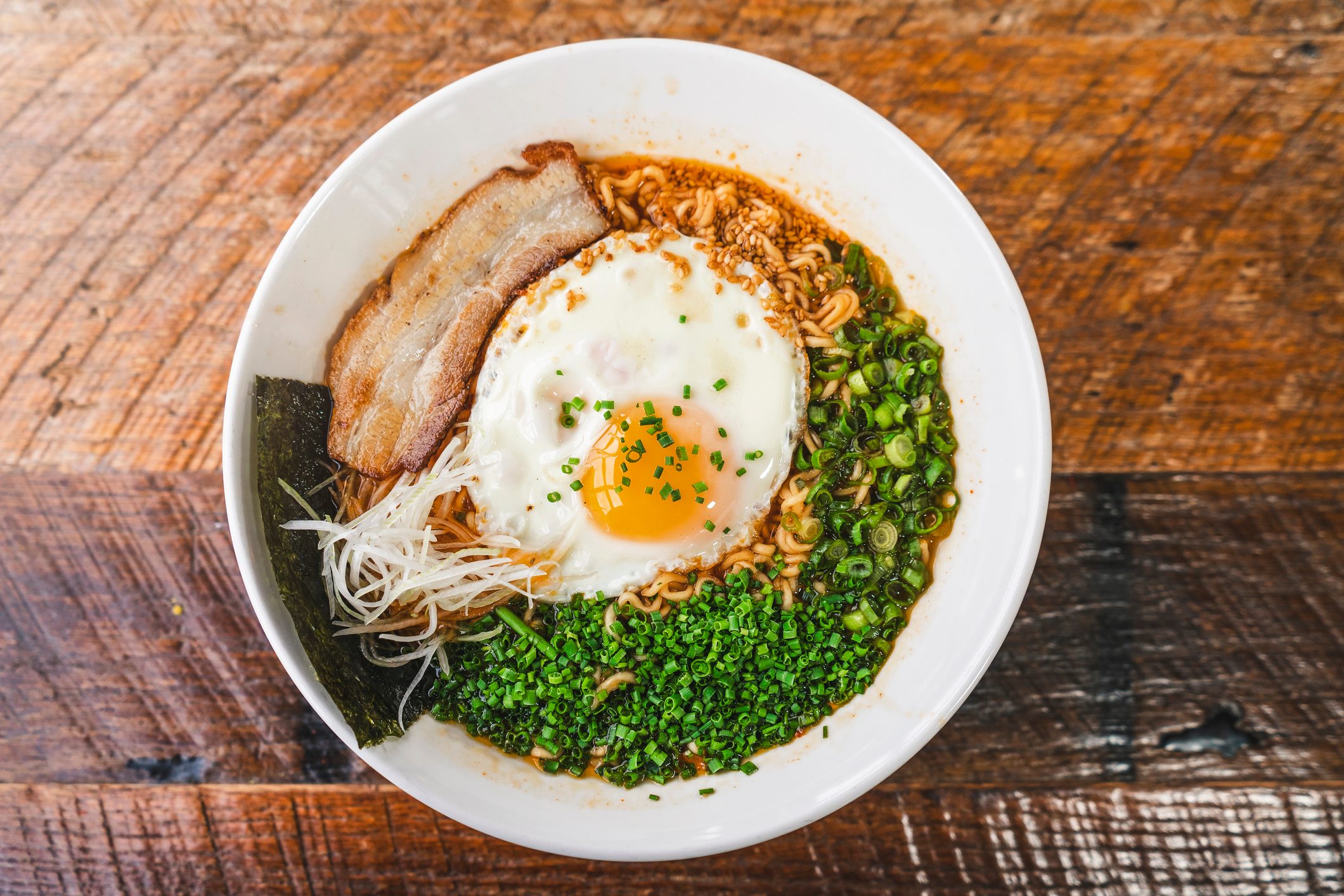 noodle soup bowl with whole fried egg on top