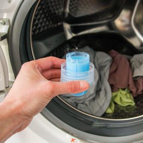 measuring cup of liquid laundry detergent