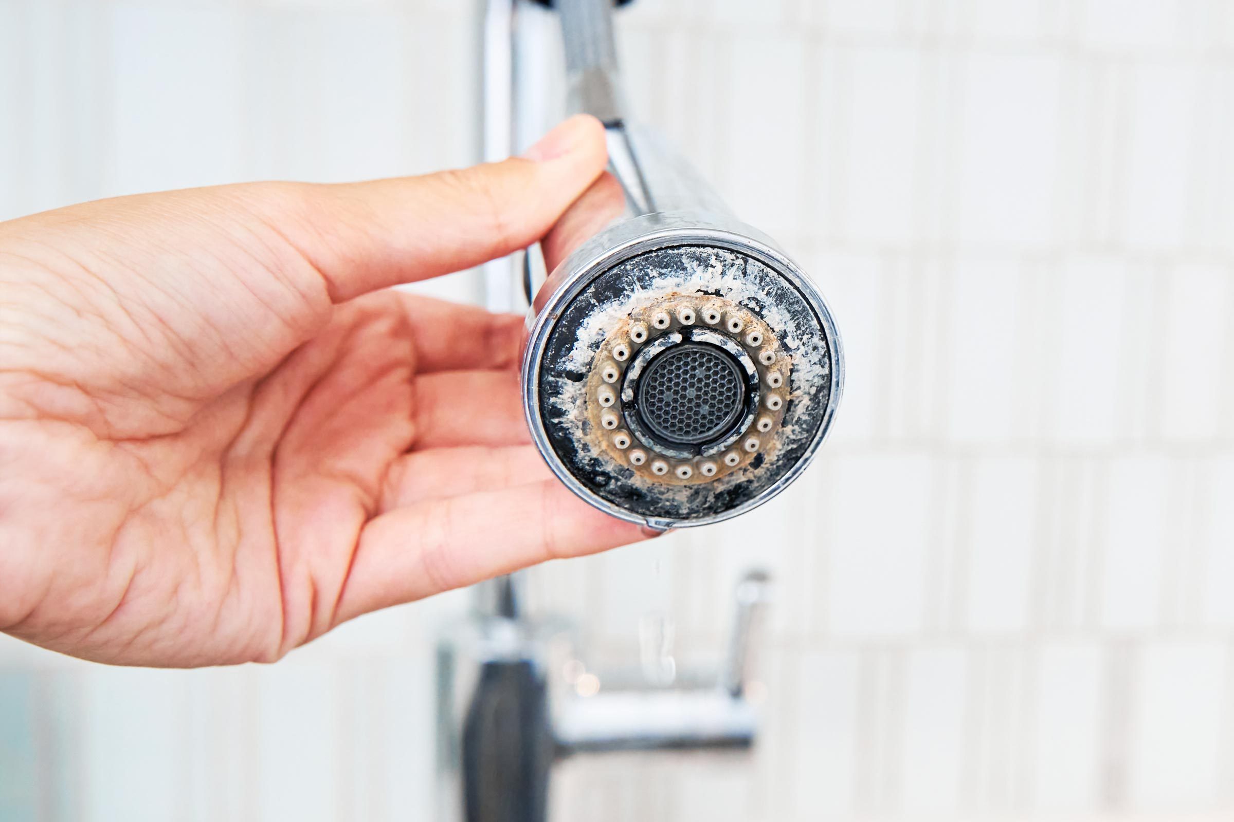 buildup on a faucet head in kitchen