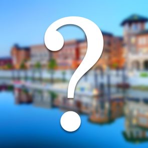 white question mark over blurry travel destination location