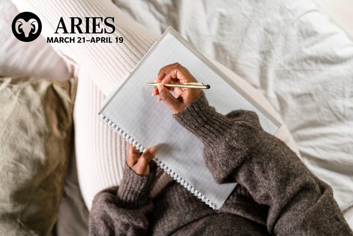 woman writing in her journal