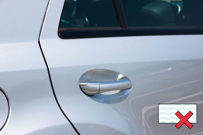 car door with a "no magic eraser symbol" in the corner