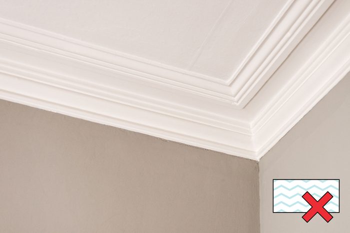 glossy wall moulding with a "no magic eraser symbol" in the corner