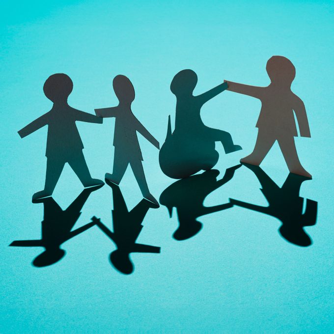 paper figures making friends on a blue background