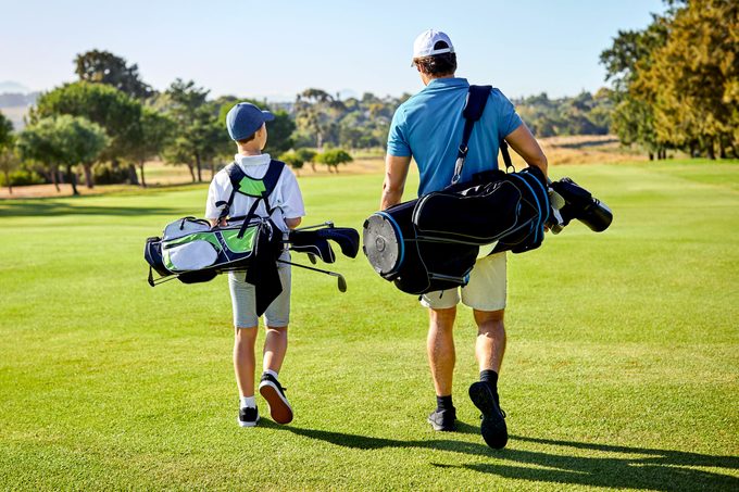 father and son golfing
