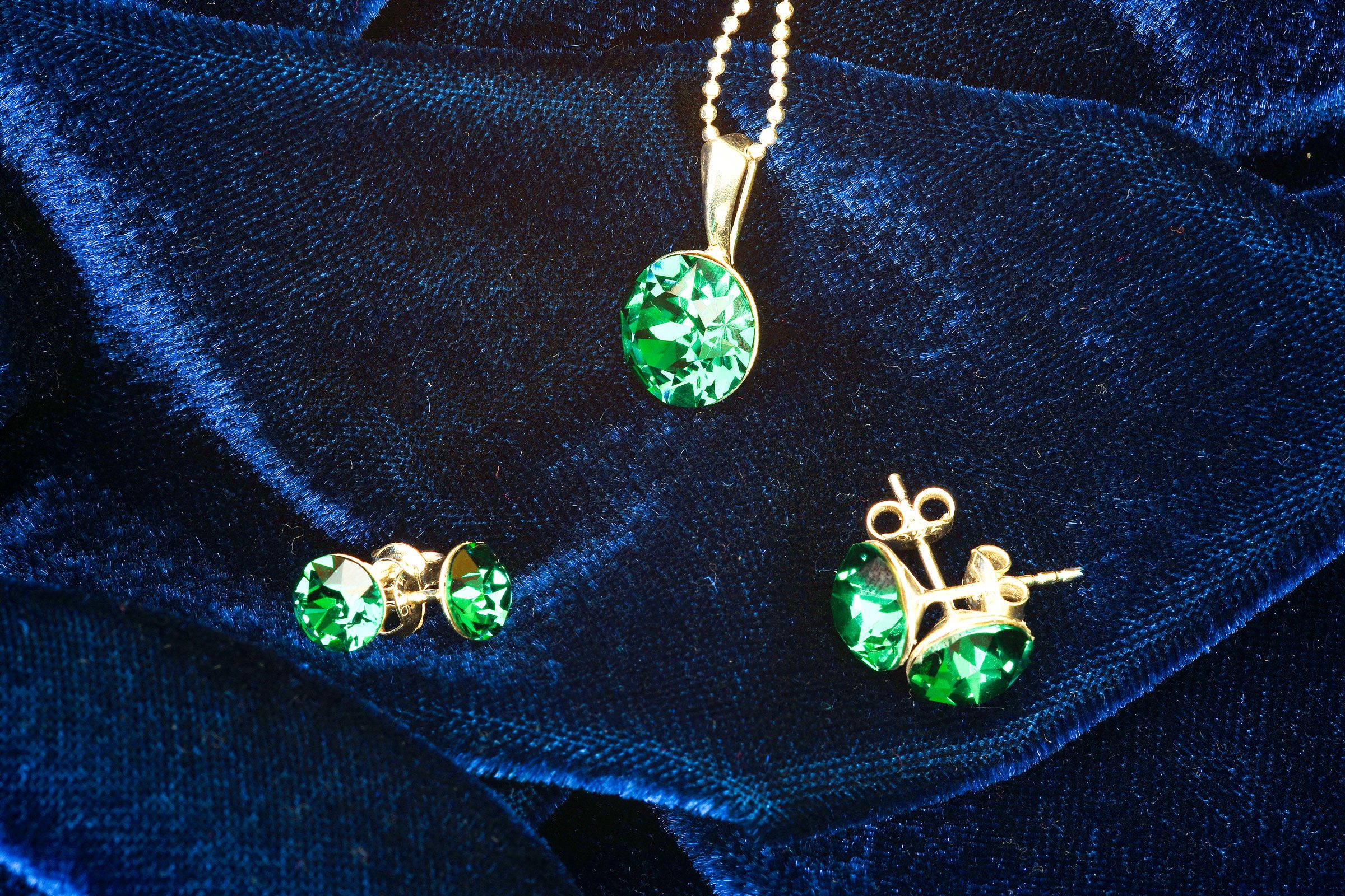 Emerald Jewelry on blue cloth