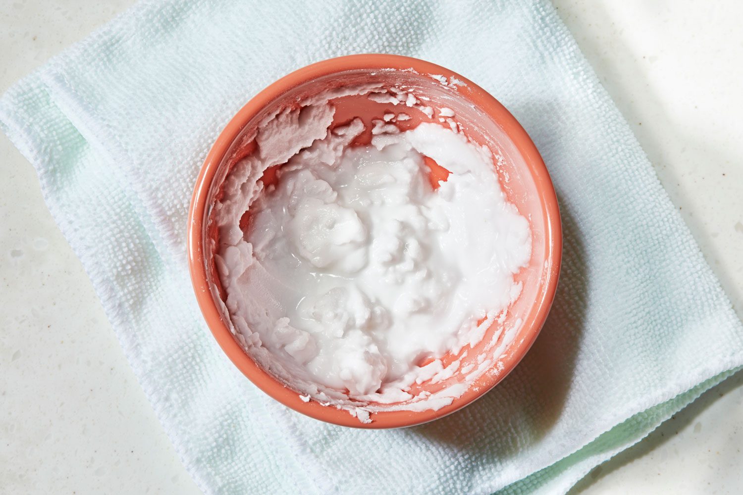 in a bowl, paste made with baking soda and water